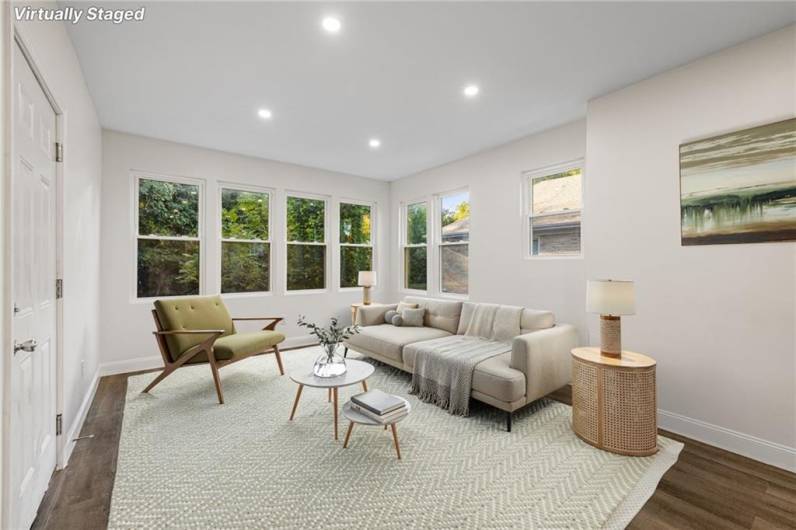 Sunny living room with lots of windows and modern open floor plan