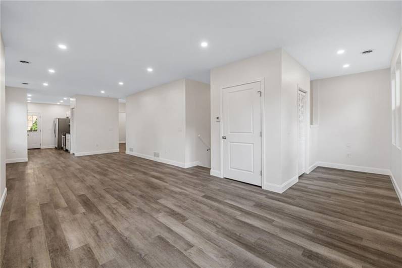 Sunny modern floor plan with lots of windows, recessed lighting and wood-look LTV flooring