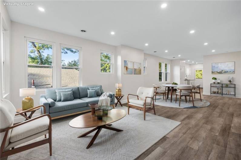 Sunny modern floor plan with lots of windows, recessed lighting and wood-look LTV flooring