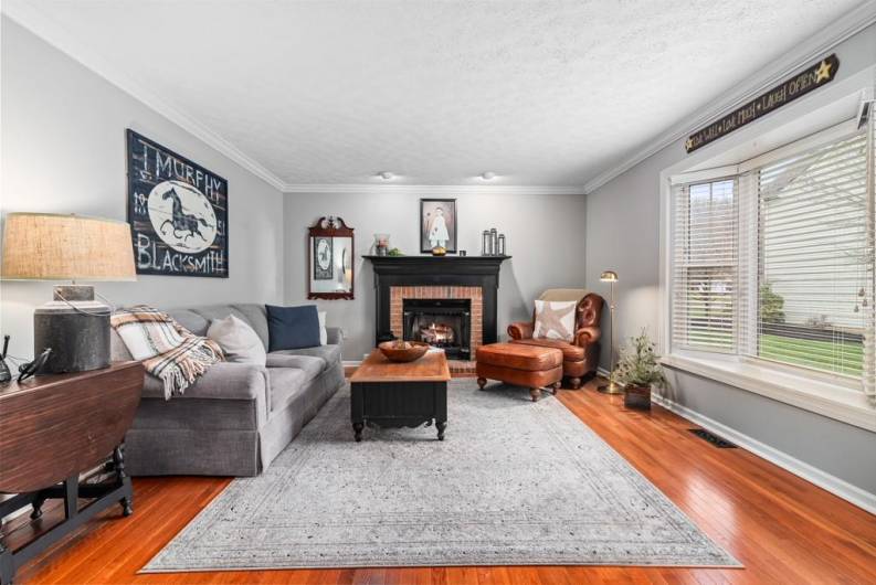 Famliy room is open to the kitchen with cozy fireplace