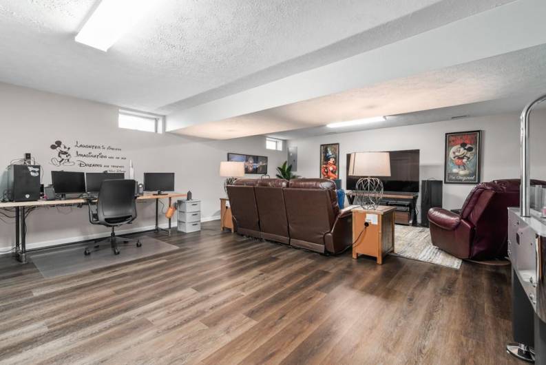 game room lower level with laminate flooring