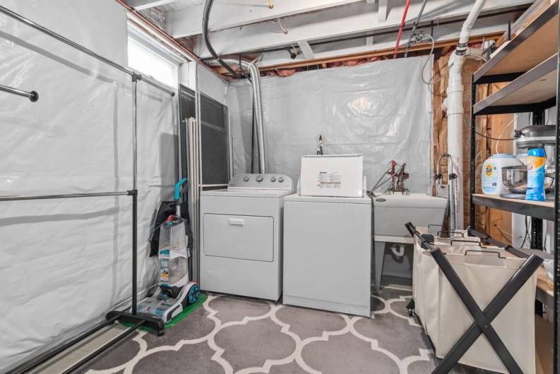 lower level laundry room with plenty of storage space