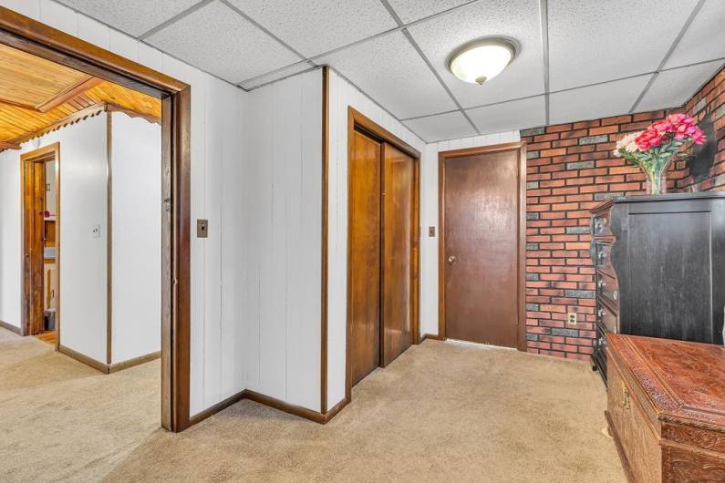 Sitting area in primary bedroom and large wardrobe closet.