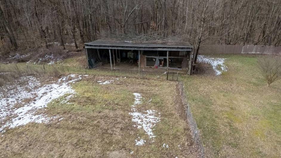 View of additional farming/garden and chicken coop with storage.