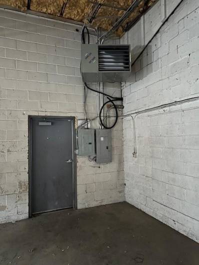 Gas heater in 3 bay garage.