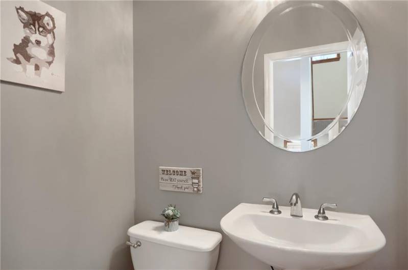 Conveniently located on the main level is the stylish powder room.