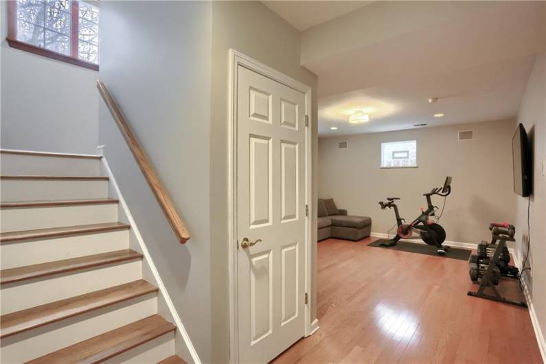 Retreat to the versatile lower level with hardwood flooring.