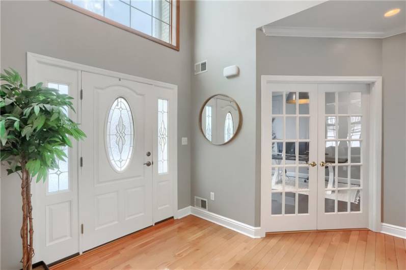 Modern white trim pops along the stylish paint tone throughout the home and blends seamlessly with the hardwood flooring.