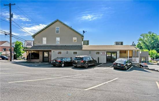 Contingent Business - Bar/Tavern fully leased, 3 apartments (above) - fully leased, tanning salon (lower level (not shown in photo) - fully leased over 30 years