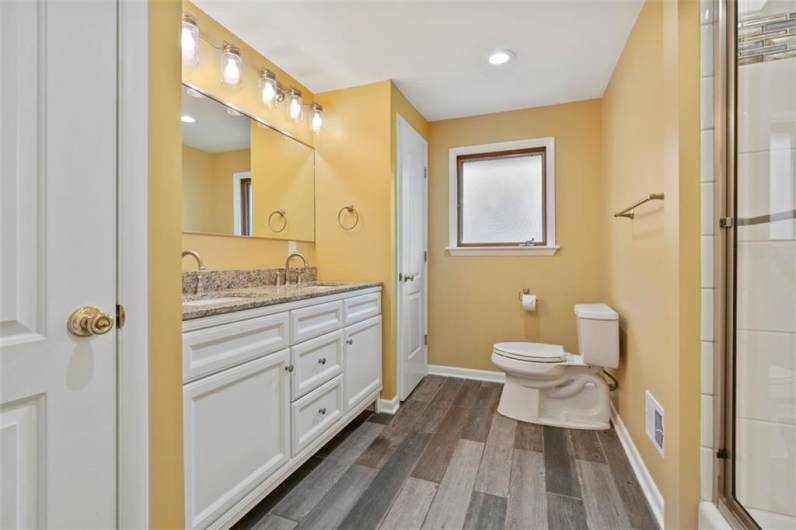 The first-floor main hallway bathroom has been recently updated with new flooring, countertop, sinks, faucets toilet, flooring and much more!