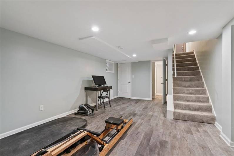 This newly remodeled oversized room has many options for your family.  An office, an exercise room, craft room and/or whatever your family needs.  There is easy access to the full lower-level updated bathroom, too!