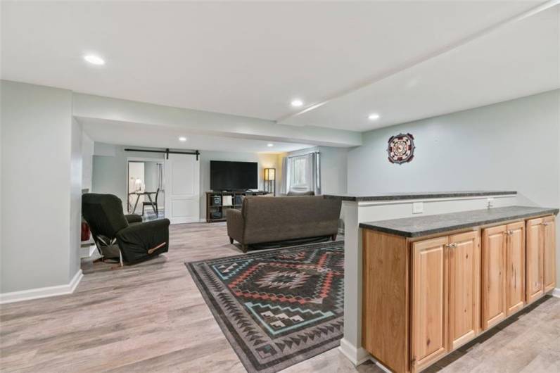 Is a fun entertainment game room what you are looking for with a bar area, log burning fireplace, here it is? Yes, so much space for your family and a wonderful room for entertaining, too! Stop by and see for yourself!