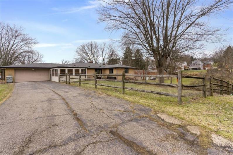 Planning on entertaining? This extended driveway can accommodate at least 5 cars, plus the attached 2 car garage, offers so much extra space in the finished lower level. Plenty of space for everyone, invite your family and friends!