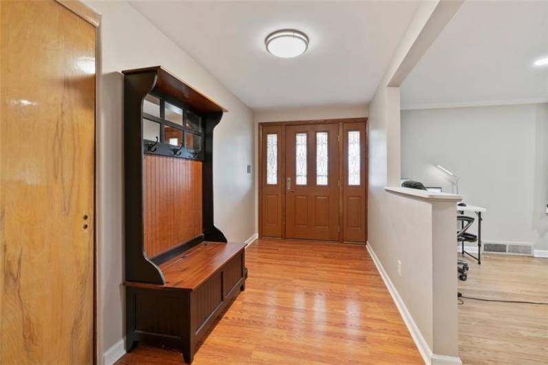 The oversized front hallway/entry way is 12'x'6' with beautiful hardwood flooring.