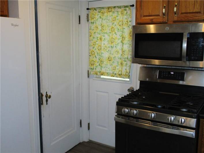 The kitchen has a covered back patio that leads to a nice spacious yard with an above ground pool and fenced in yard.