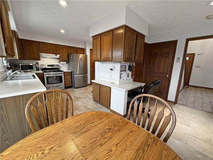 The kitchen also features a pantry and  a powder room close by.