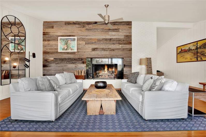 Stunning fireplace boasts reclaimed wood