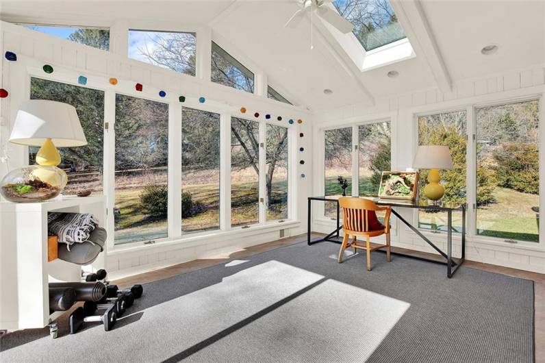 Bright and airy sunroom overlooks private back yard