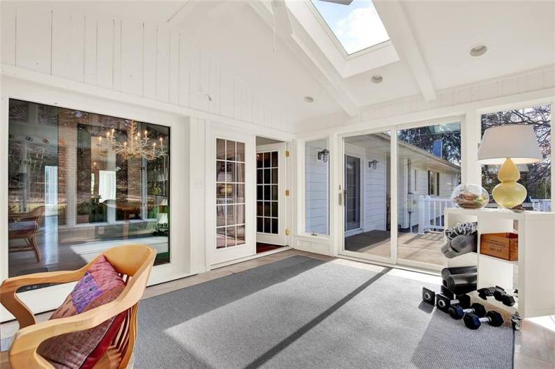 Another view of the sunroom with doors to the back deck. Perfect for entertaining!