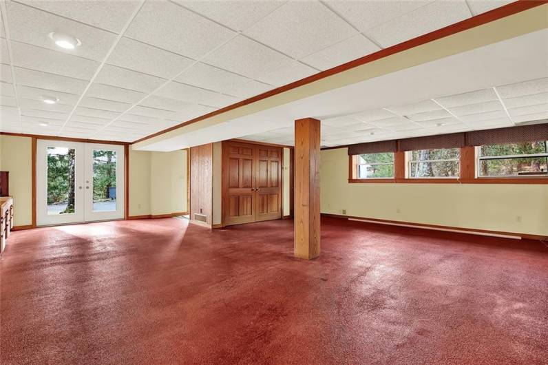 Large lower level game room with walk-out to detached garage.