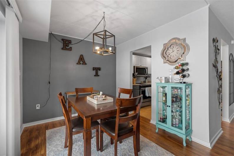 Dining room has LVP flooring and is open to living room