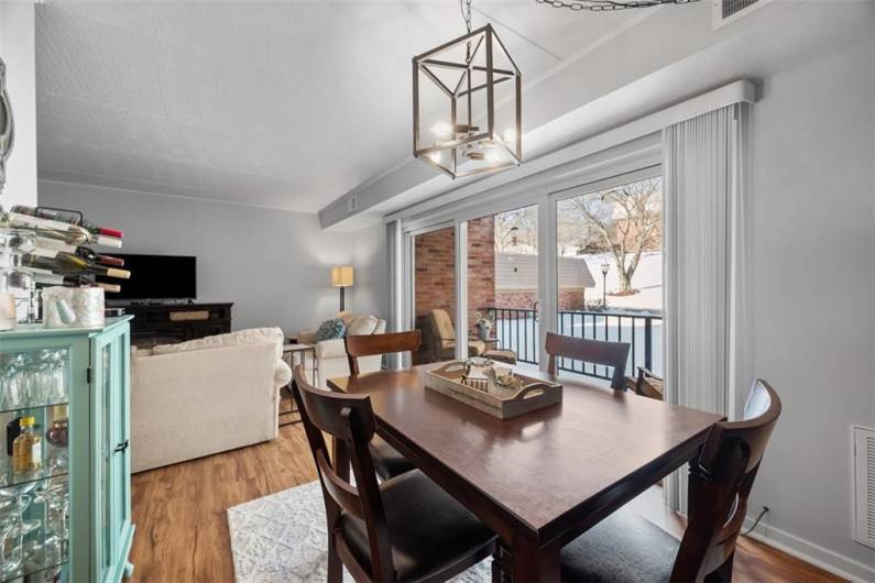 Dining room has LVP flooring and is open to living room