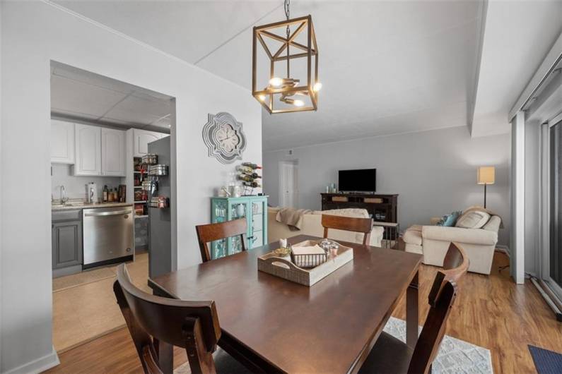 Dining room has LVP flooring and is open to living room