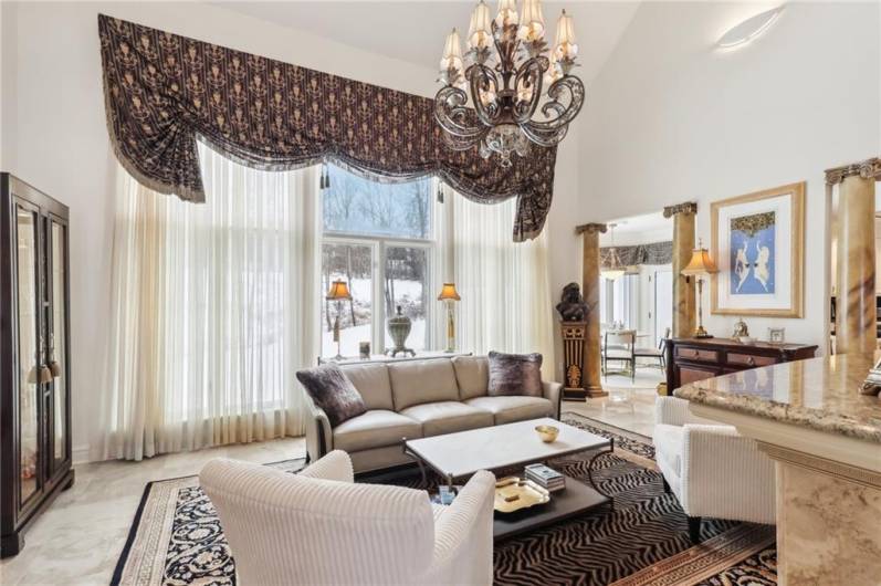 Double stacked two story windows overlook the fabulous rear yard, nature preserve and golf course.