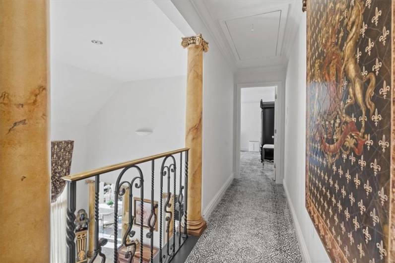 Upper-level hallway with Juliette balcony