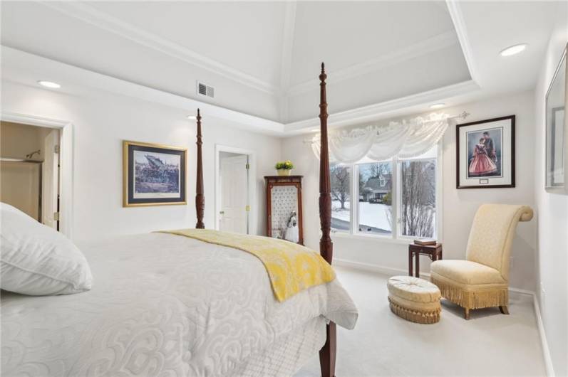 Fourth bedroom with dramatic trey ceiling, crown moldings and walk-in closet