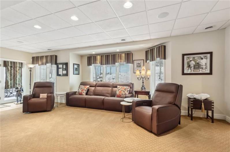 Lower level media room with full length windows