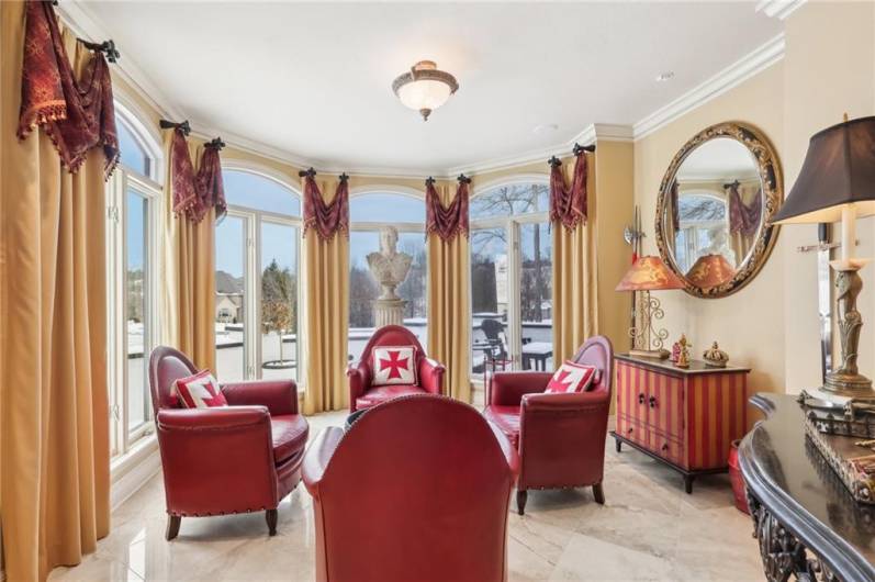 Octagonal floor to ceiling windows highlight the den.