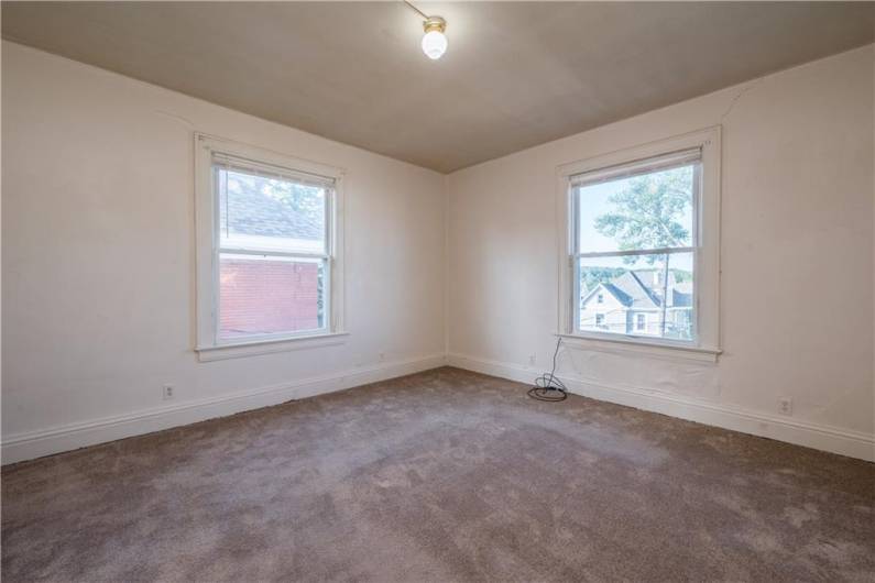 Large bedroom with plenty of natural light.