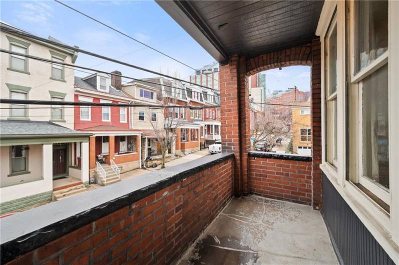 This is the 2nd floor front balcony. Perfect for some potted plants or herbs. Great sunny exposure, facing primarily east, northeast. Children's Hospital is visible up the street.