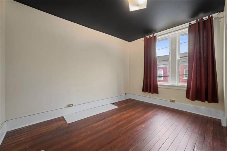 The Primary Bedroom is on the right as you enter the 2nd floor unit. Smooth gorgeous floors, and lots of sunlight plus a large closet, complete the features.