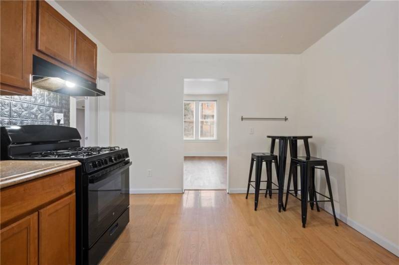 So spacious, plenty of space for a stand alone pantry cabinet if you desire,  as well as a table and chairs.