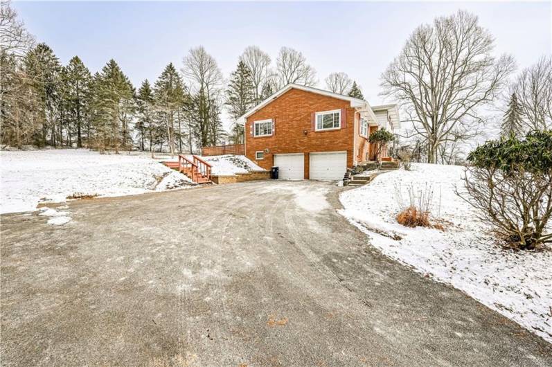 THE DRIVEWAY IS WIDER AT THE TOP FOR MORE PARKING AREA TO WELCOME FRIENDS AND FAMILY