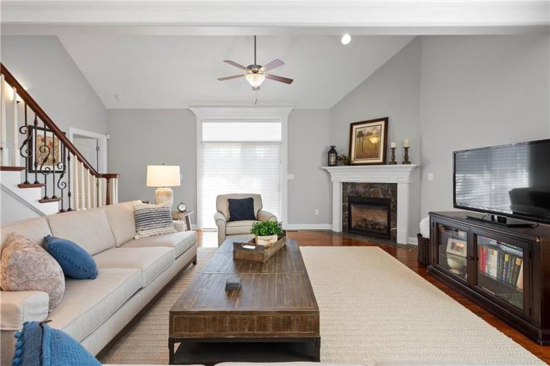 The family room is highlighted by vaulted ceilings and a corner gas log fireplace!