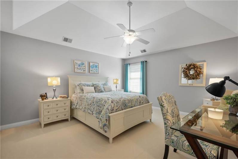 A deep tray ceiling highlights the second floor guest room.