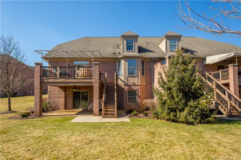 Above the patio is a low maintenance deck which comes complete with awning.  (Currently stored at Laurel Awning)  Another custom feature is the brick pillars from the deck to the patio.