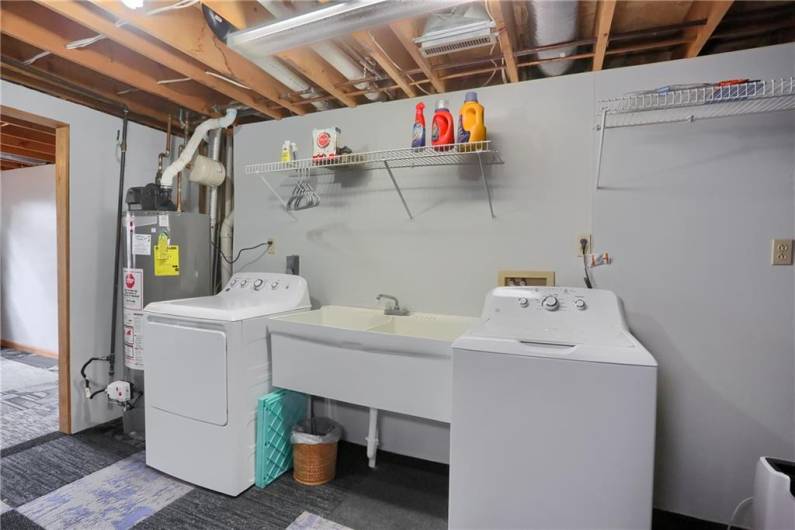 Even chores in this home are a delight with a spacious laundry area compete with a laundry sink.