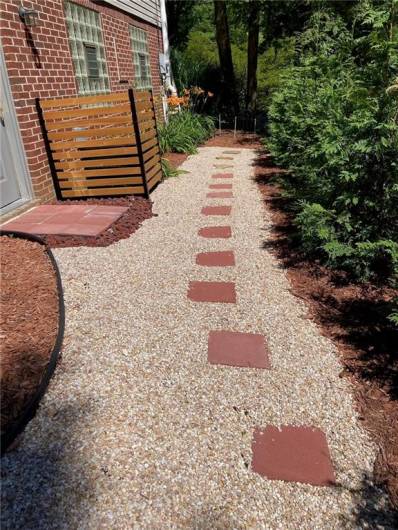 Professional landscaping is featured around the home.