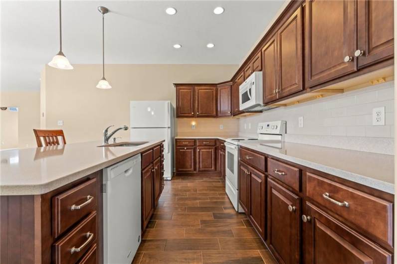 Lots of Cherry Wood Cabinetry in Beautiful Kitchen w/ Ceramic Subway Tile Backsplash, Ceramic Floors & Granite Countertops!