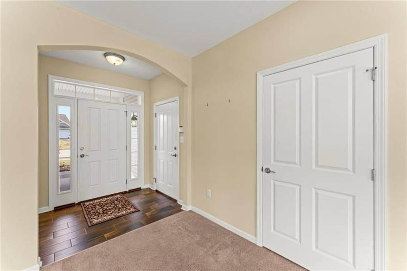 Closer View of Door to Garage & Coat Closet in Entryway