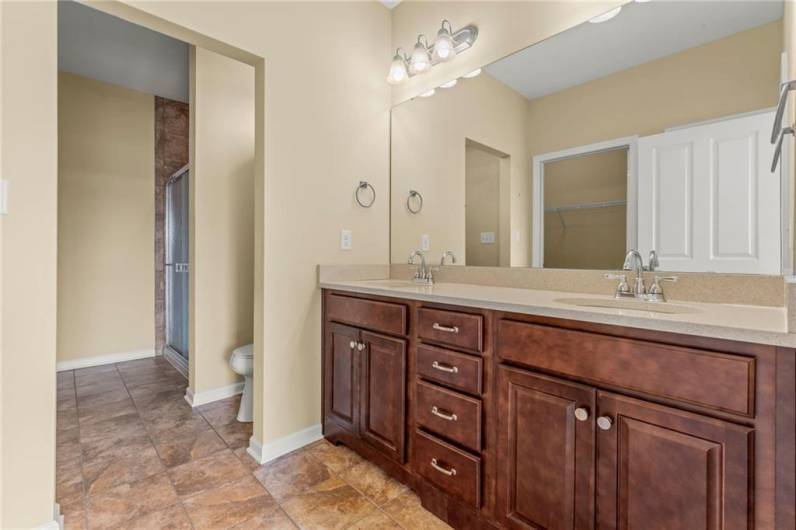 Double Granite Top Vanity in Master En Suite Full Bathroom w/ Ceramic Tile Shower Stall and Linen Closet