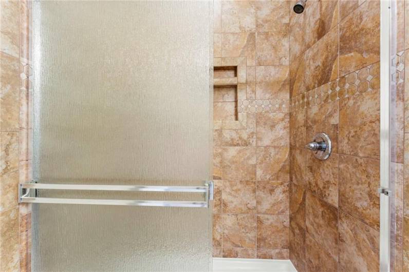 View of Ceramic Tile Shower Stall in En Suite FUll Bathroom