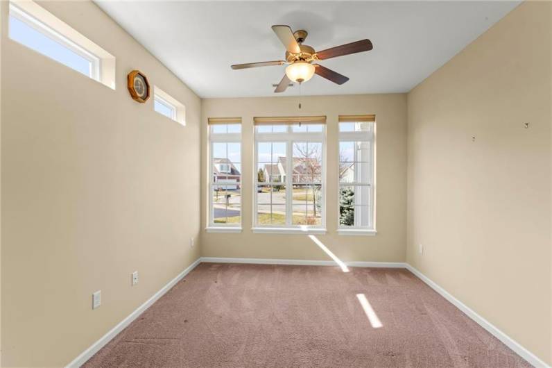 Separate 11x11 Dining Room w/ Big Front Window and Transom Windows on side plus Ceiling Fan Light or could be Wonderful Sunroom or an office or workout area