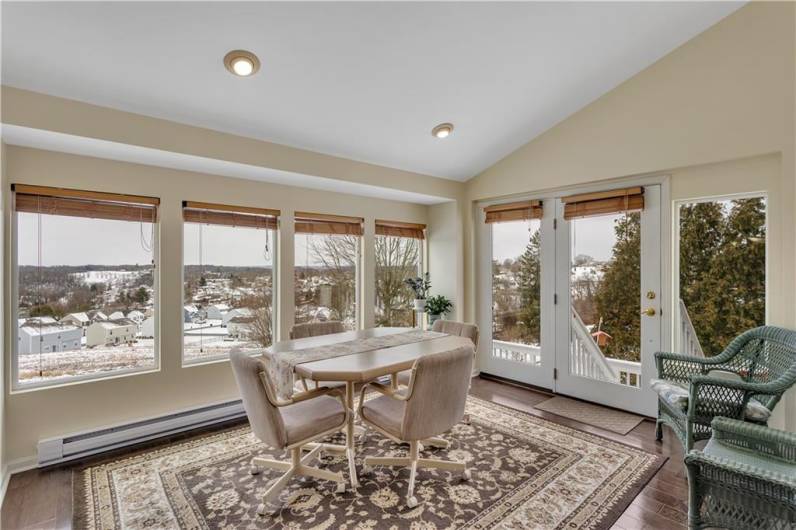 Gorgeous Sunroom featuring a vaulted sloped ceiling & recessed lighting!