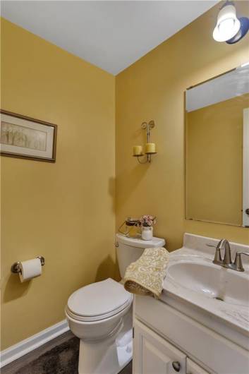 Powder room includes luxury vinyl flooring