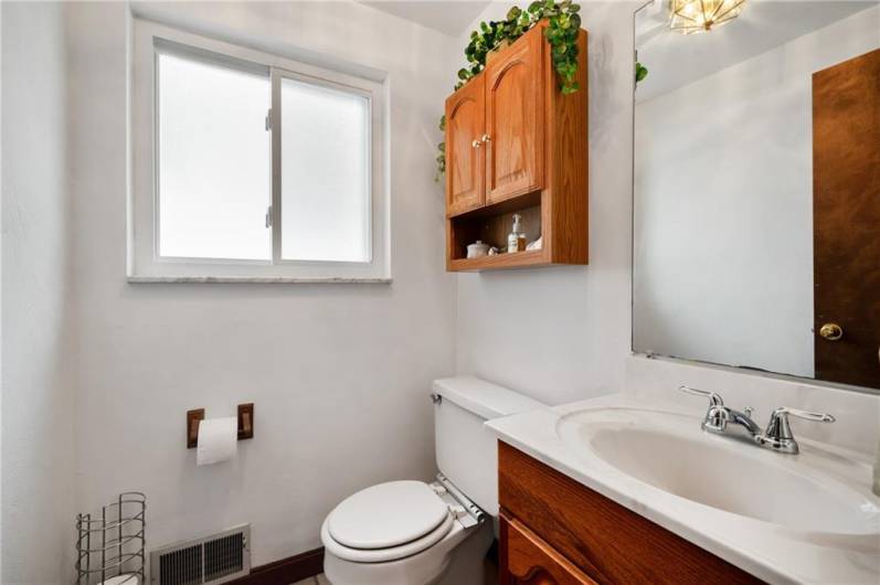 A bathroom on the main level offers convenience while entertaining.